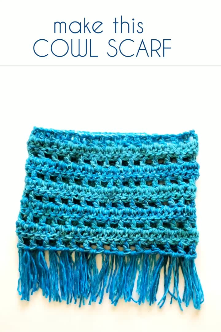 This may contain: a blue crocheted scarf with fringes on it and the words make this couli scarf