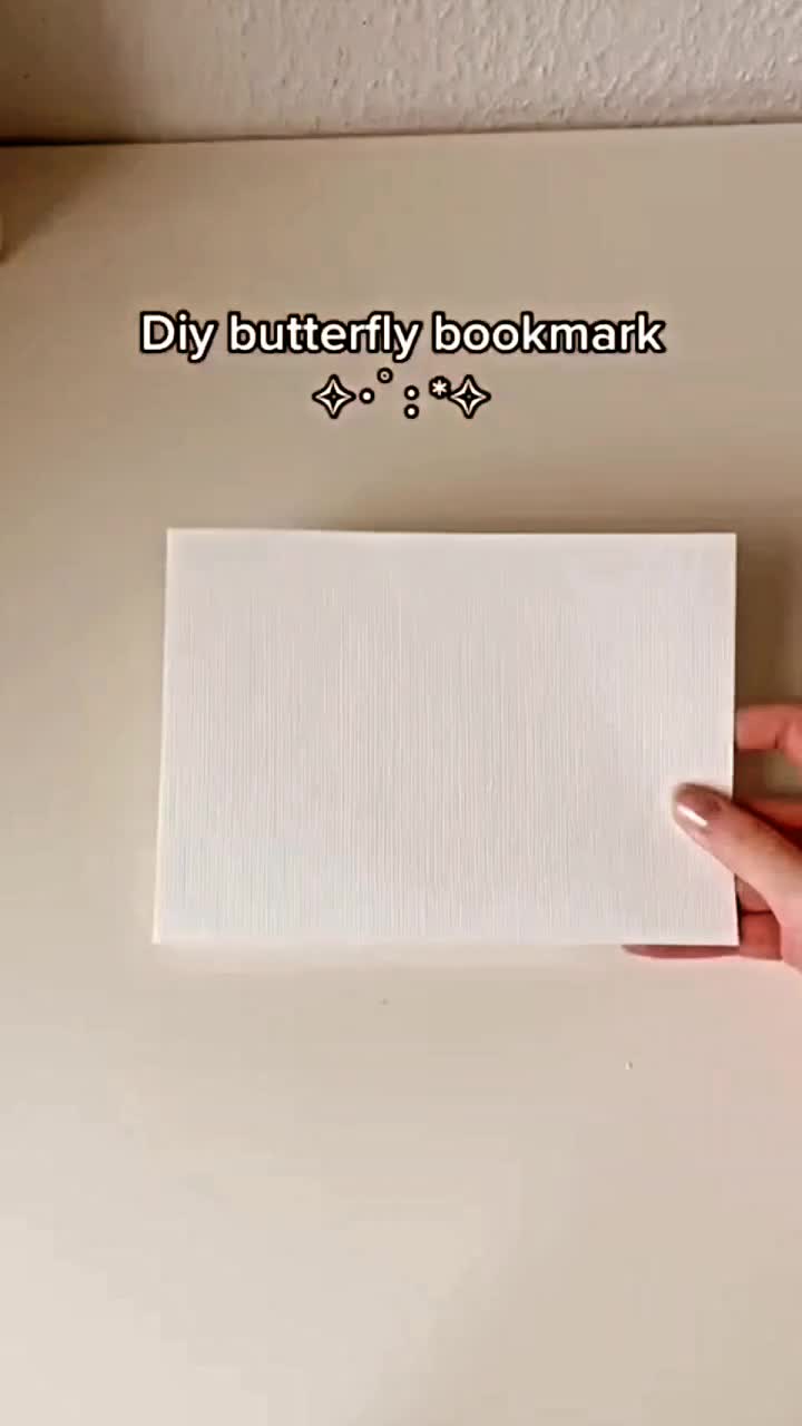 This contains: DIY butterfly bookmark: Whimsical flutter, magical reading experience, paper butterflies, vibrant colors, patterns, origami butterflies, cut-outs, skill levels, ribbons, tassels, elegance, functionality, joy of reading, imagination, literary adventures. 🦋📚✨ #DIYButterflyBookmark #BookwormDelight