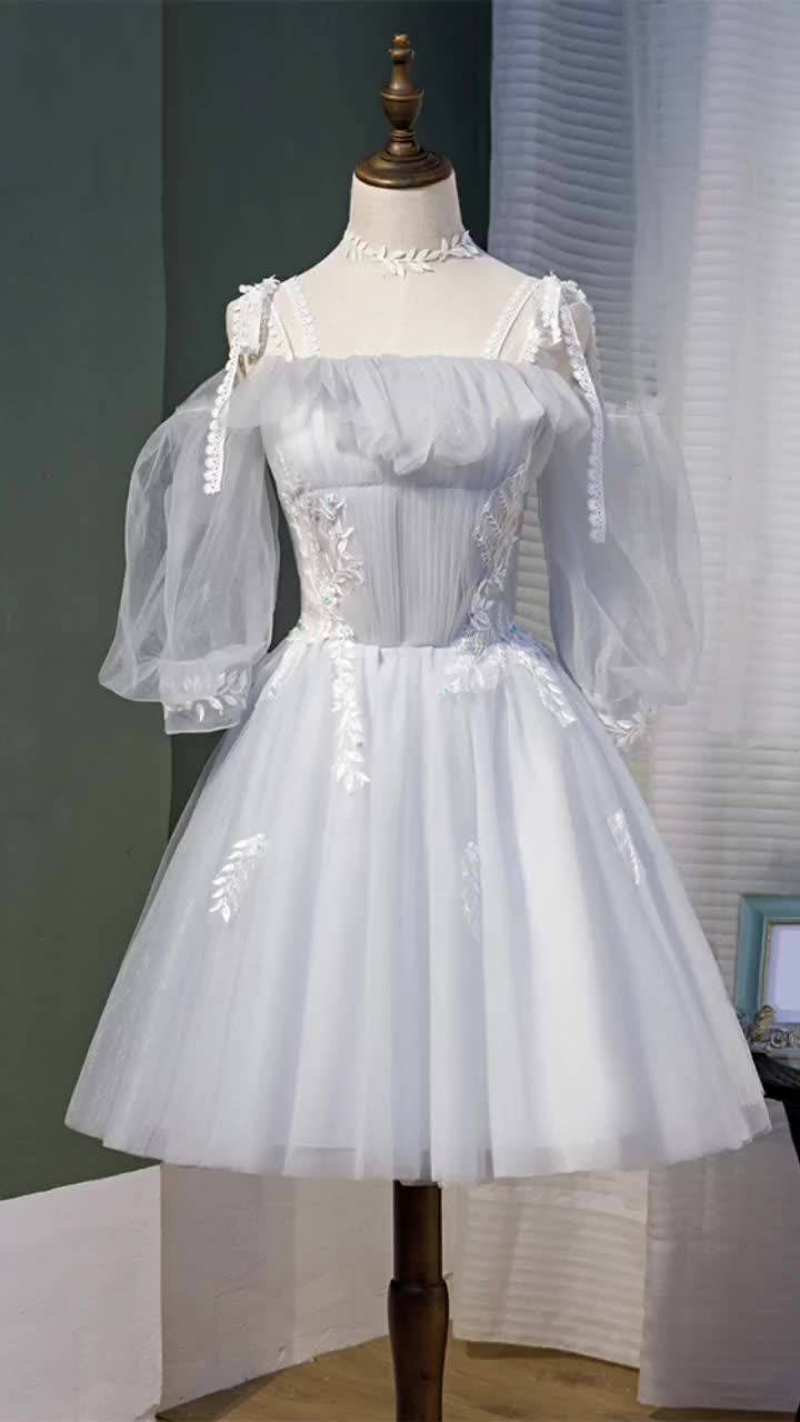 This contains: Grey Tulle Short Homecoming Dress with Appliques Sleeves