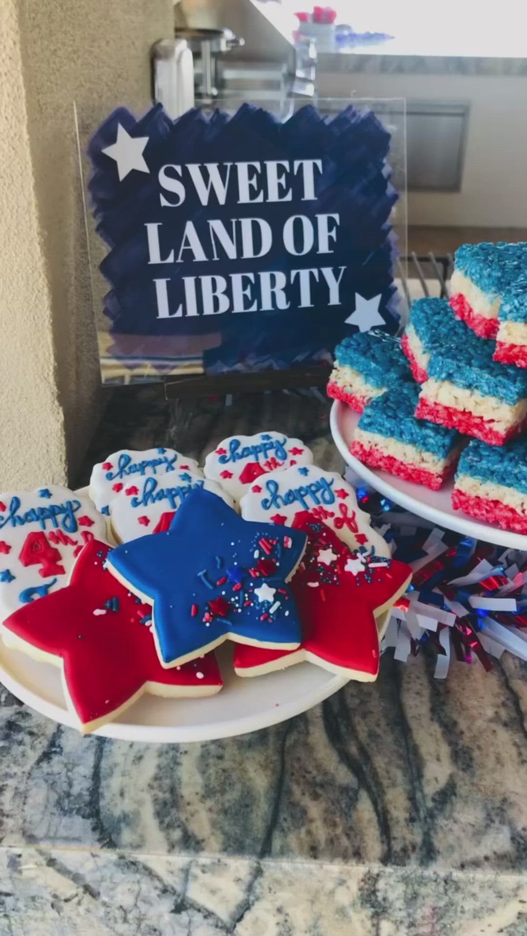 This may contain: red, white and blue desserts are on plates next to a sign that says sweet land of liberty