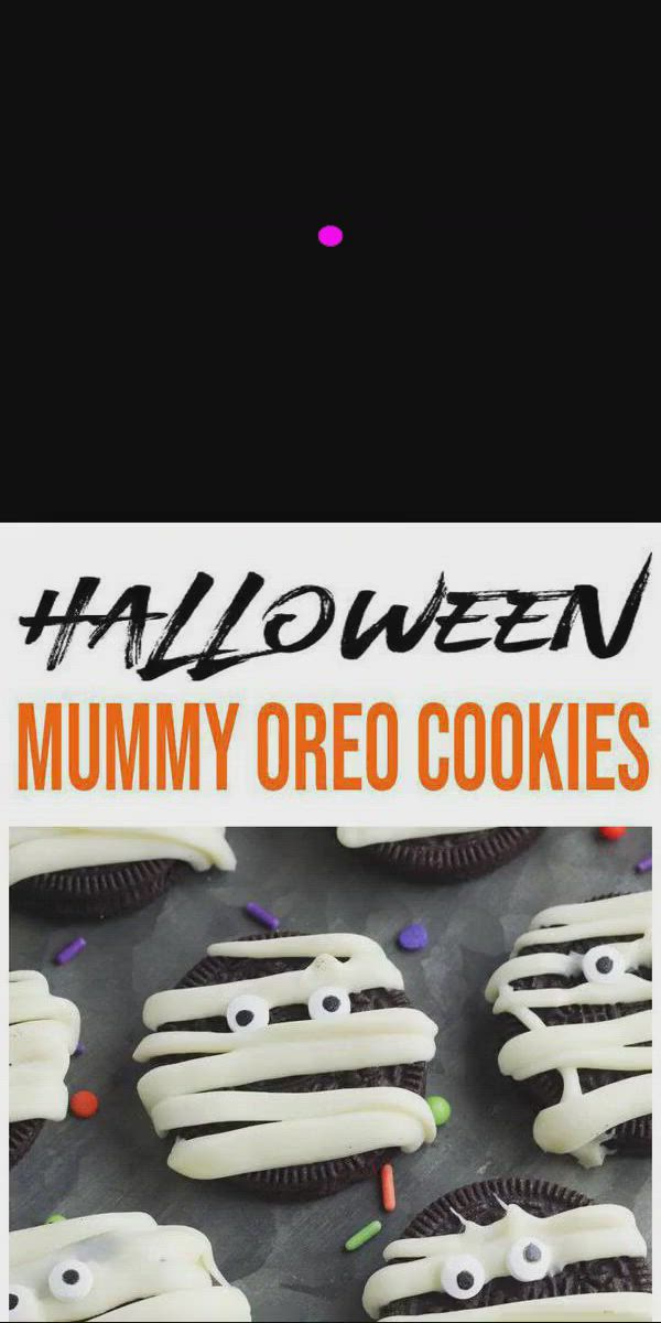 This may contain: halloween cookies with white frosting and sprinkles