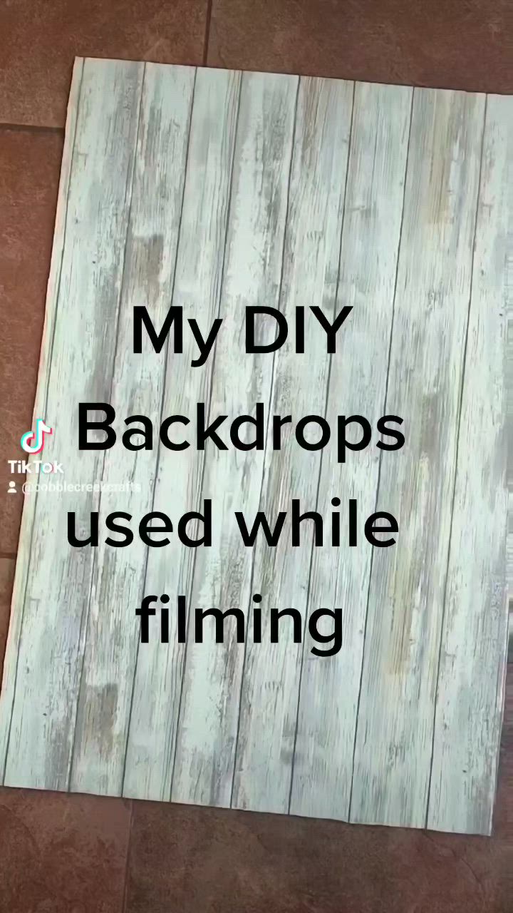 This may contain: a sign that says, my diy backdrops used while filming on the floor