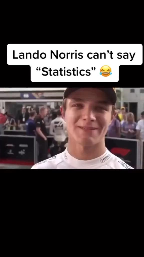 This may contain: a man wearing a yellow hat and holding a microphone in front of him with the words lando noris can't say statistics