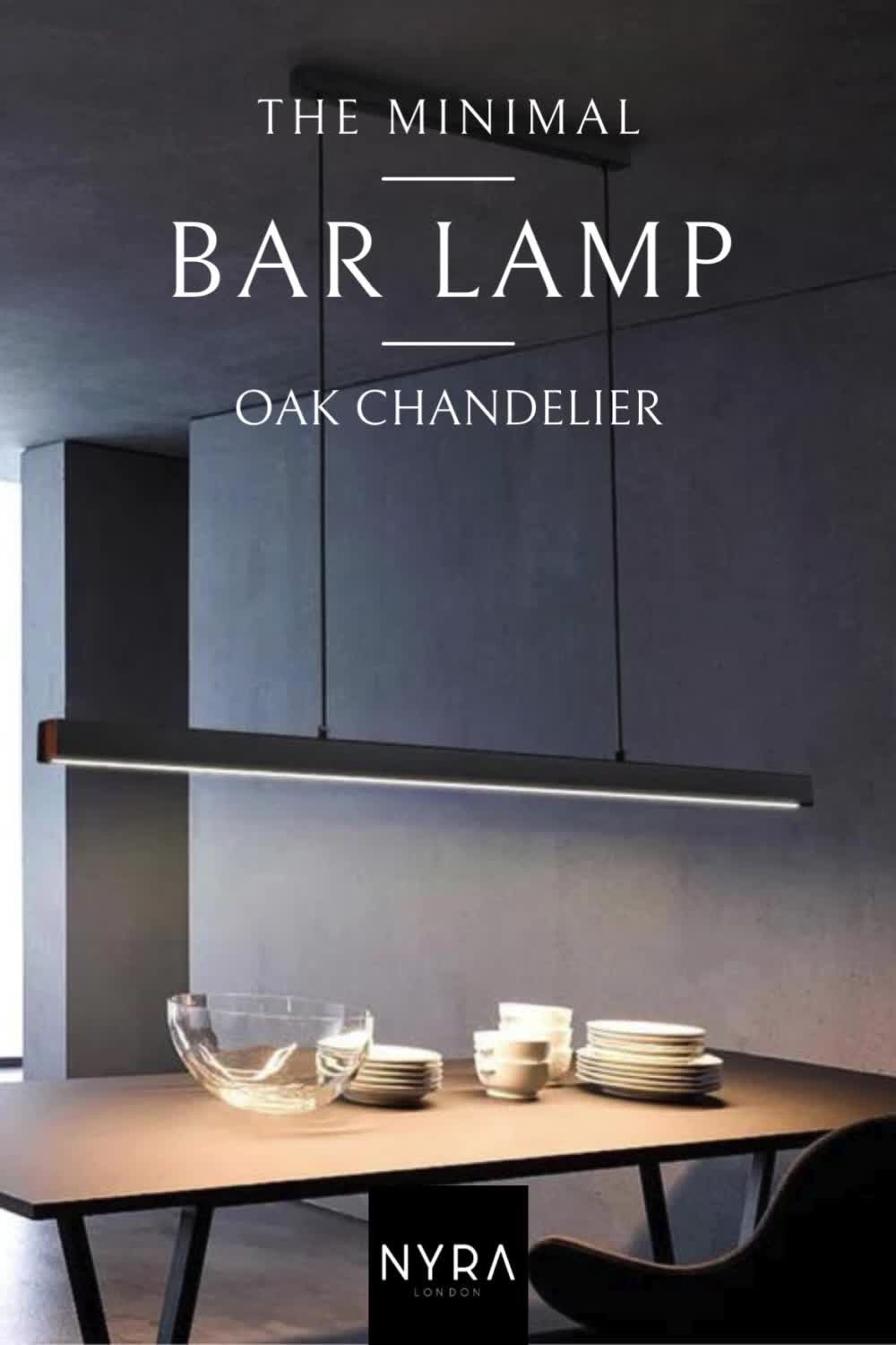 This may contain: the minimal bar lamp by oak chandelier is shown in black and white colors