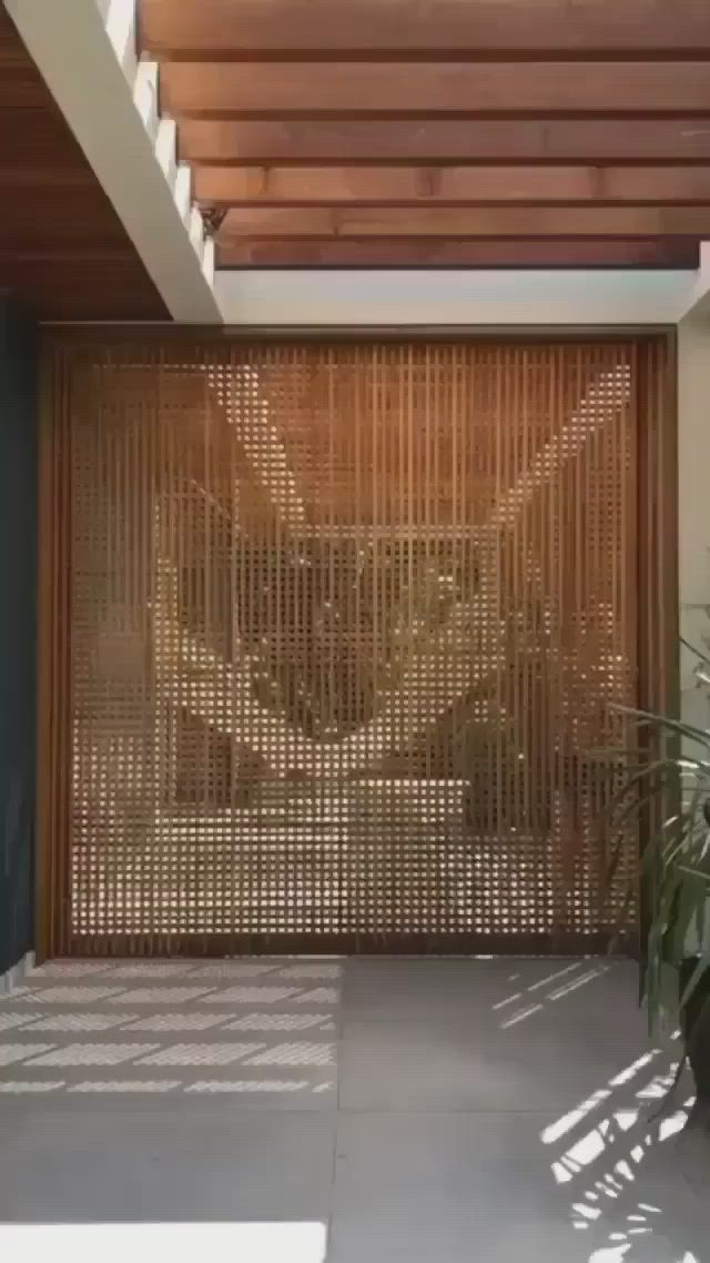 This may contain: the entrance to a house with bamboo screens on the door and windows in the wall