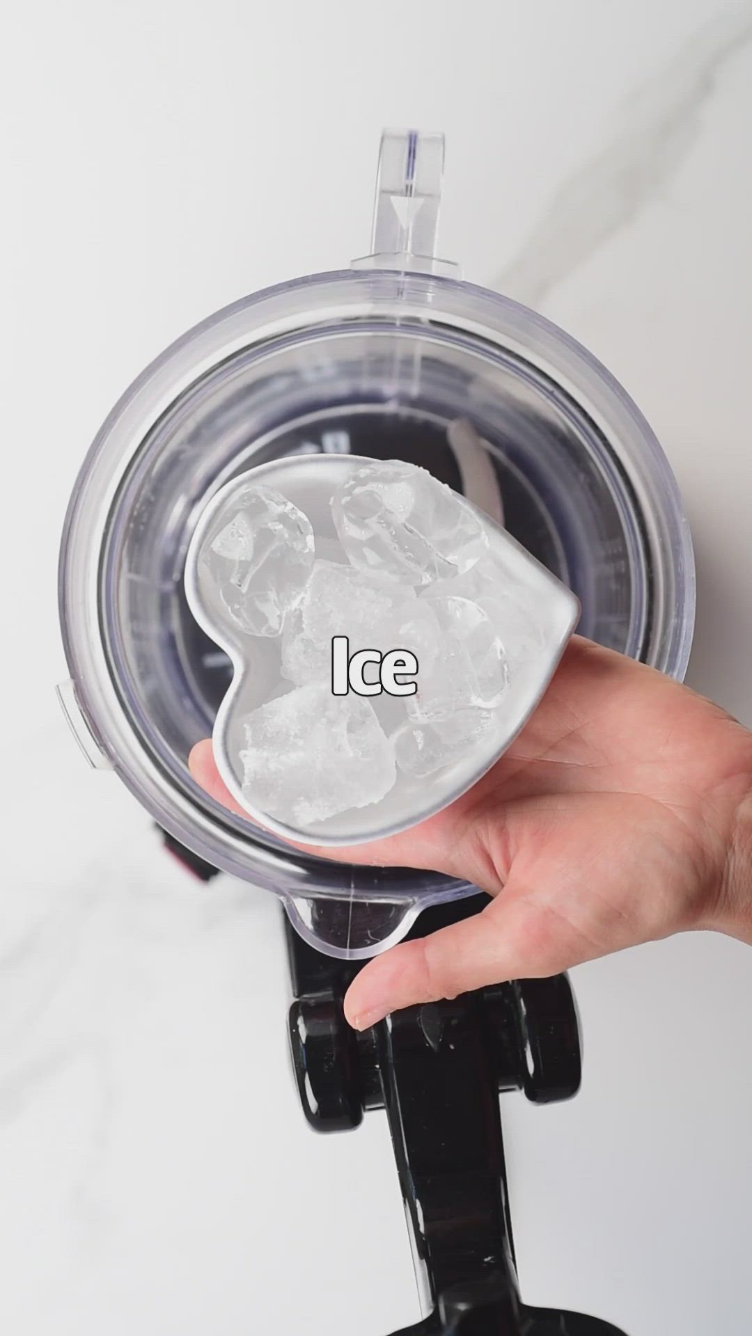 This may contain: a person holding an ice cube in their hand with the word ice written on it