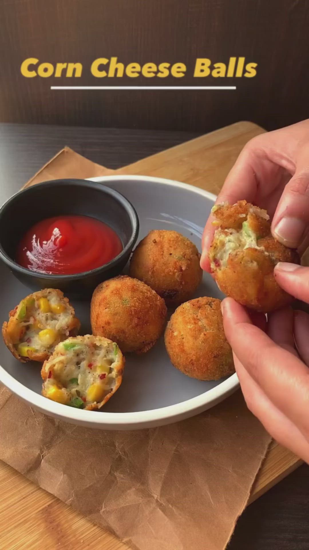 This may contain: a person is holding up some food on a plate with dipping sauce in the background