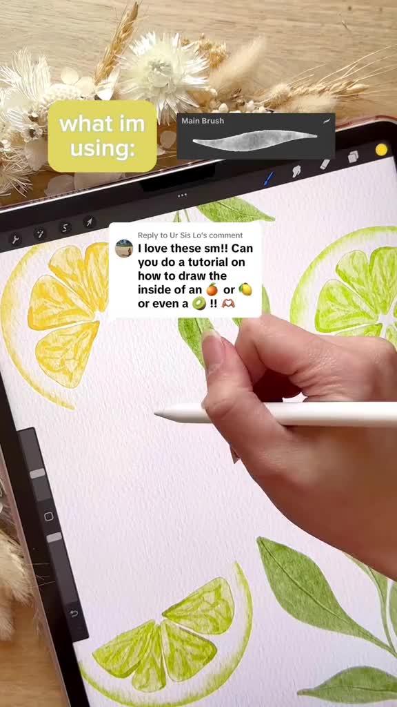 This may contain: someone is drawing on an ipad with watercolors