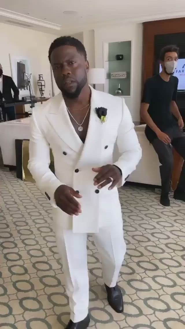 This contains an image of: Kevin Hart styling in a Sharp Suit