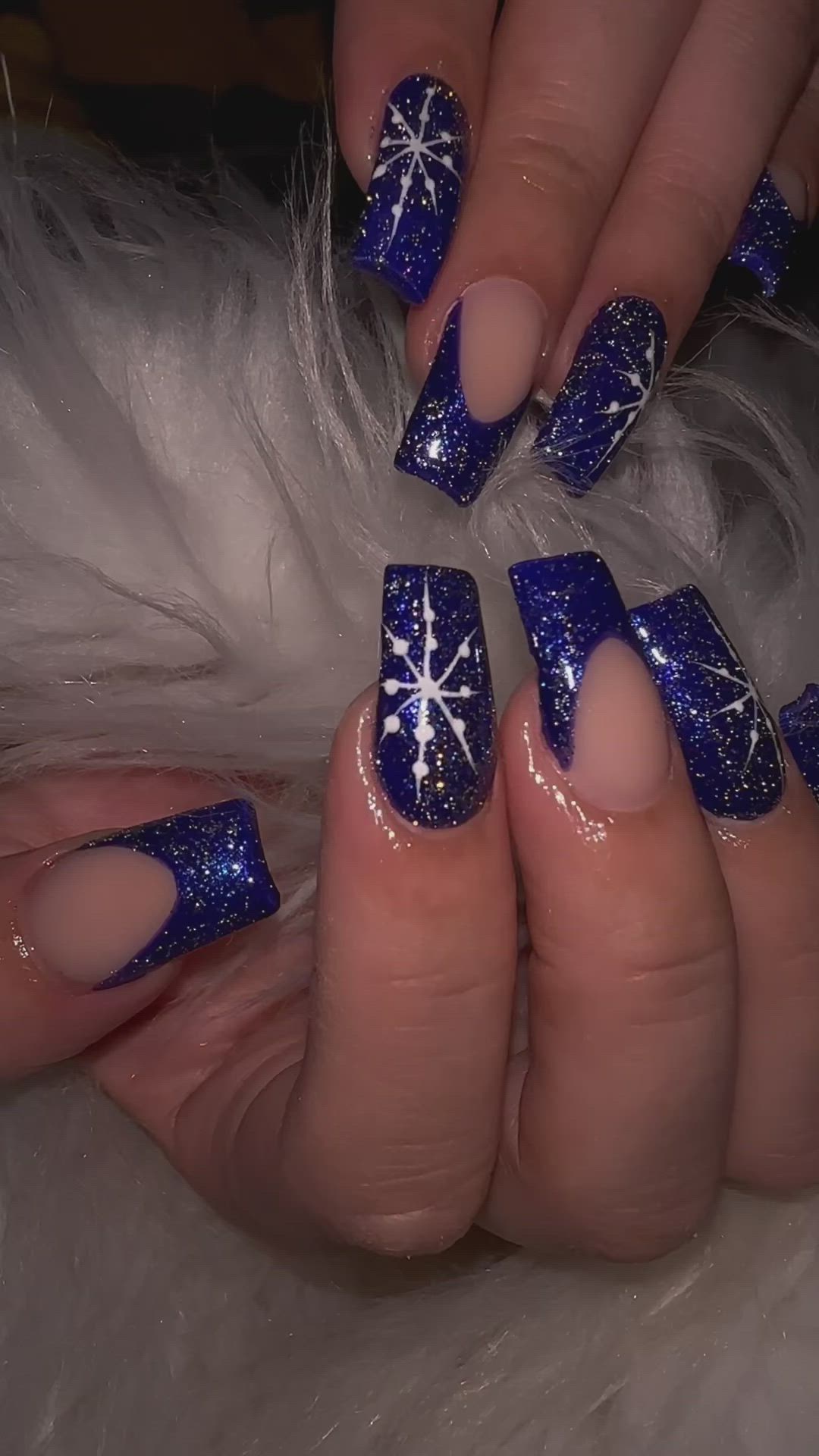 This contains an image of: Blue Christmas nails with snowflakes and reflective glitter ❄️