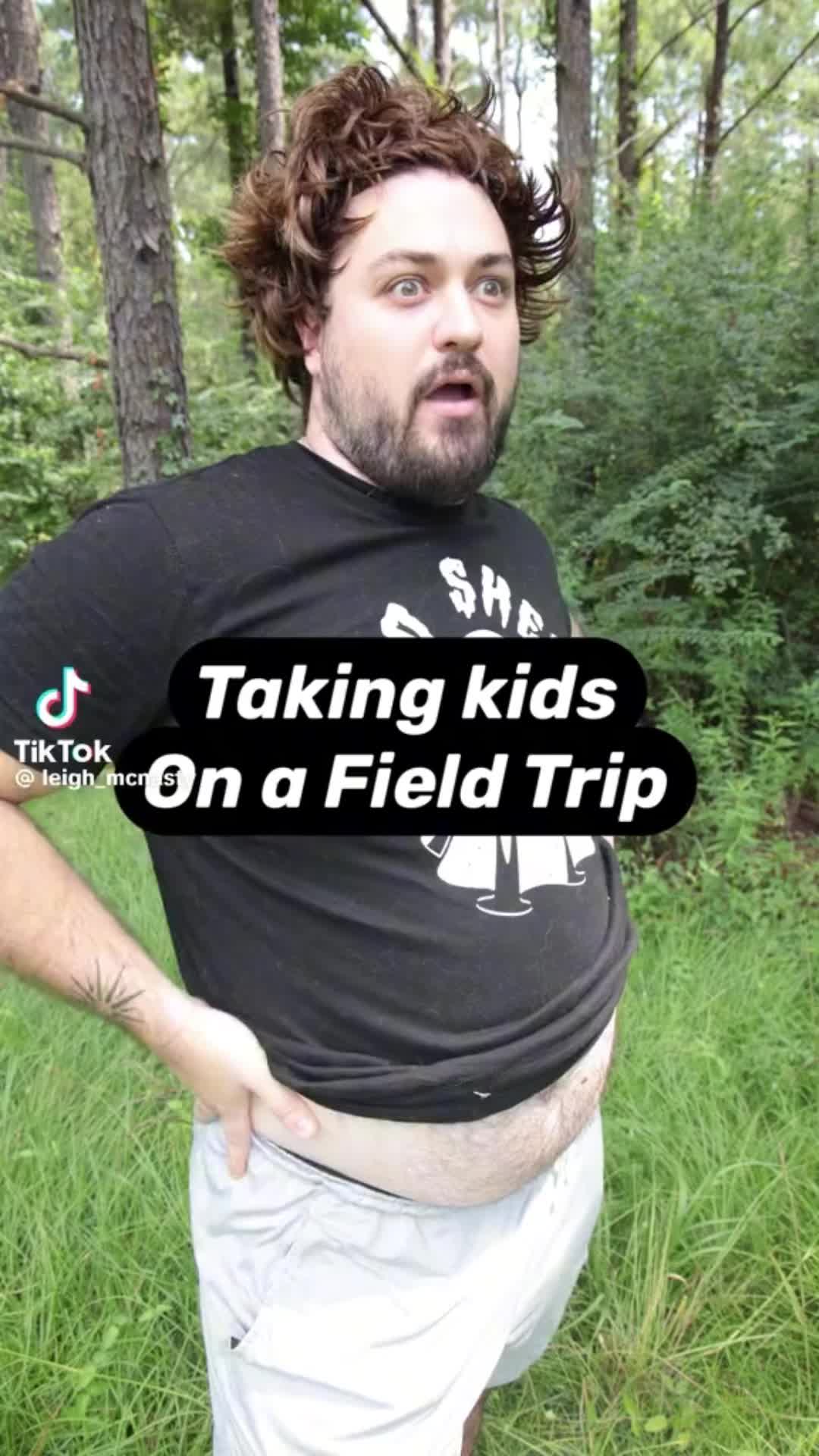 This may contain: a man standing in the grass with his hands on his hips and text that reads taking kids on a field trip