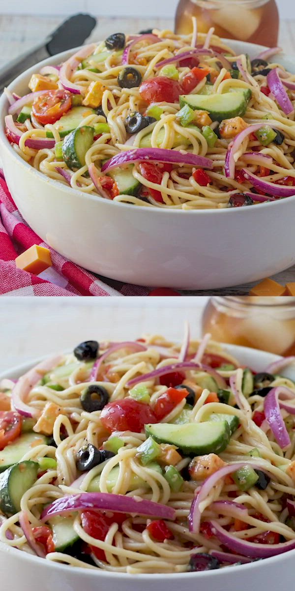 This contains: Top half of pin shows an image of spaghetti salad in a large white bowl. Bottom half of pin shows a video that shows how to make Summer Spaghetti Salad.