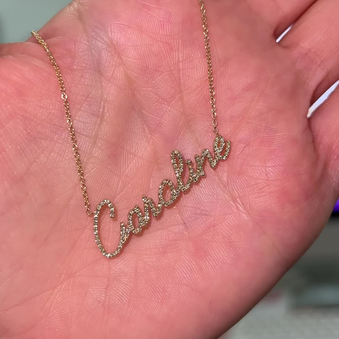 Our Diamond Custom Script Name Necklace is the newest addition to our name necklaces. Made for the true diamond lover!  Pick up to 10 letters or characters to create a one of a kind necklace. Set in solid 14K gold attached to a delicate cable chain with optional lengths. 

Largest letter ~13mm (1/2" Inch) - Shortest Letter ~6mm (1/4" Inch)
High Quality G Color VS2 Clarity Natural Diamonds

Average 7 Letter Name: 0.50ctw
14K Solid Gold
Lifetime Guarantee
Made in Los Angeles