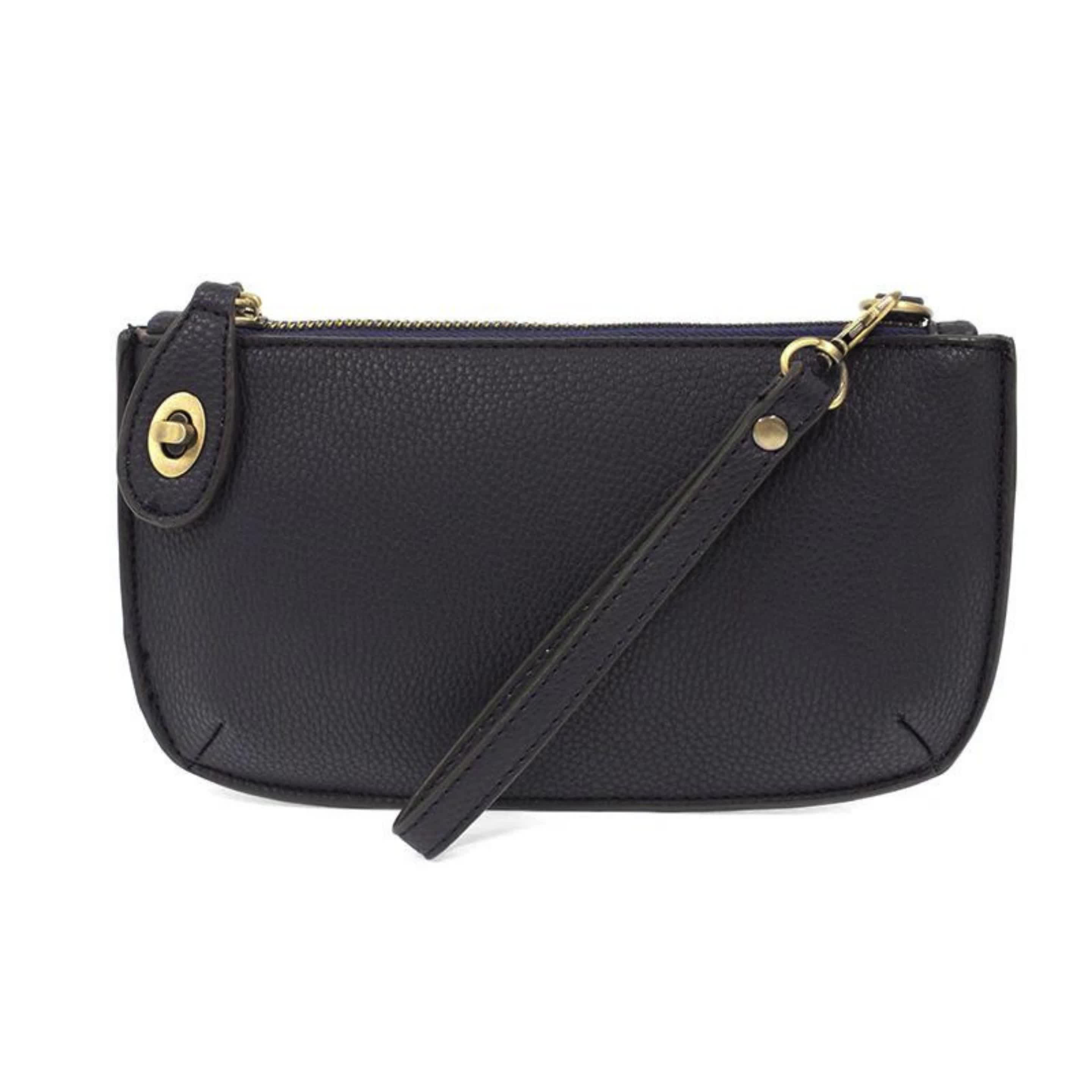 Indulge yourself with our Mini Crossbody Wristlet in New Navy, the perfect addition to any elegant outfit. With a polished turn lock and six card slots, this mini clutch is both practical and luxurious. The interior zipper adds convenience, while removable straps allow for versatile styling options. Elevate your look with this sleek and versatile accessory. #minicrossbody #navywristlet #elegantaccessories