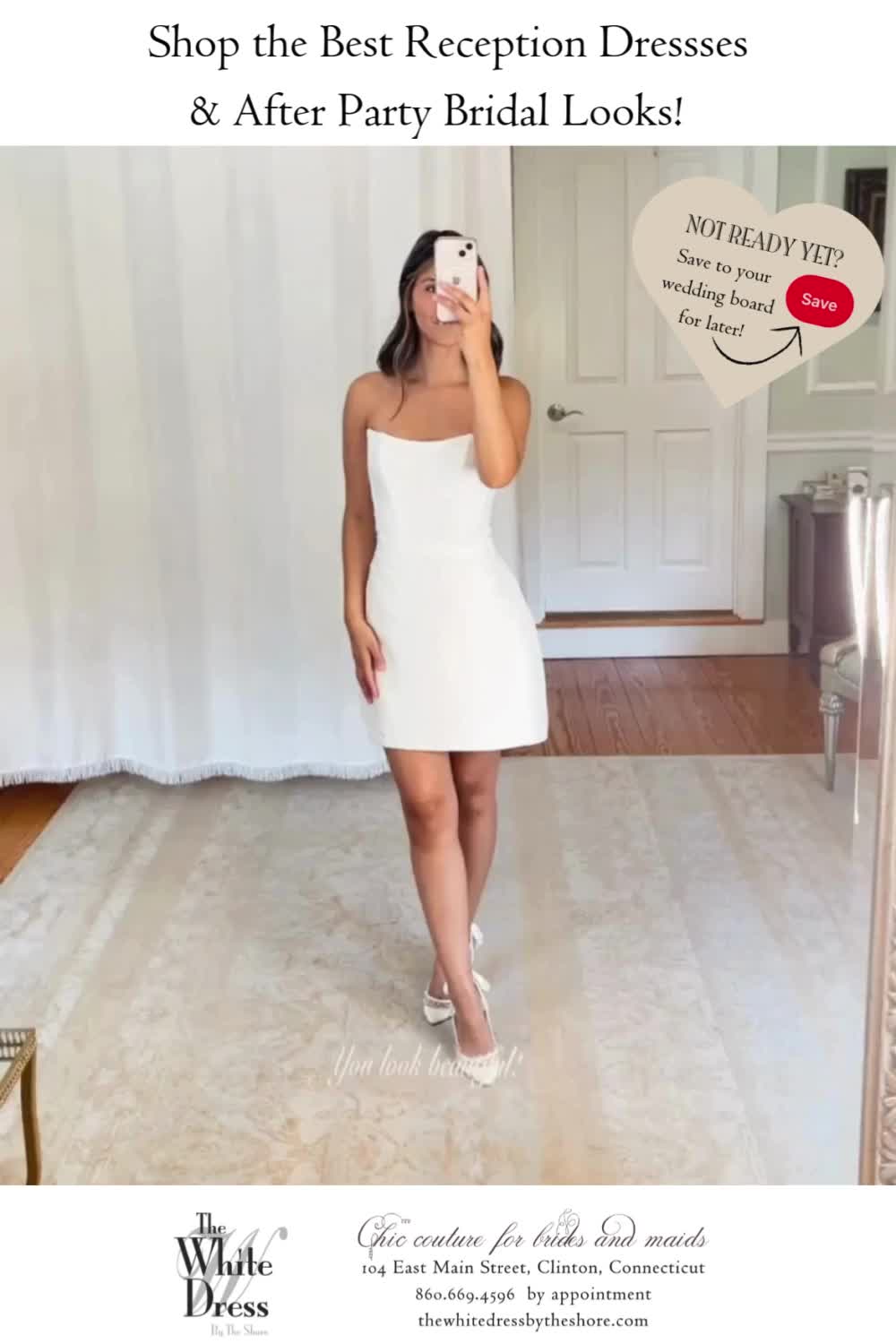 This may contain: a woman in a white dress taking a selfie with her cell phone while standing on the floor