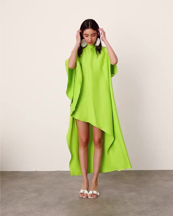 Dresses by ASOS EDITION When the dress code means a dress Plain design High neck Cape sleeves Button placket to reverse Asymmetric hem