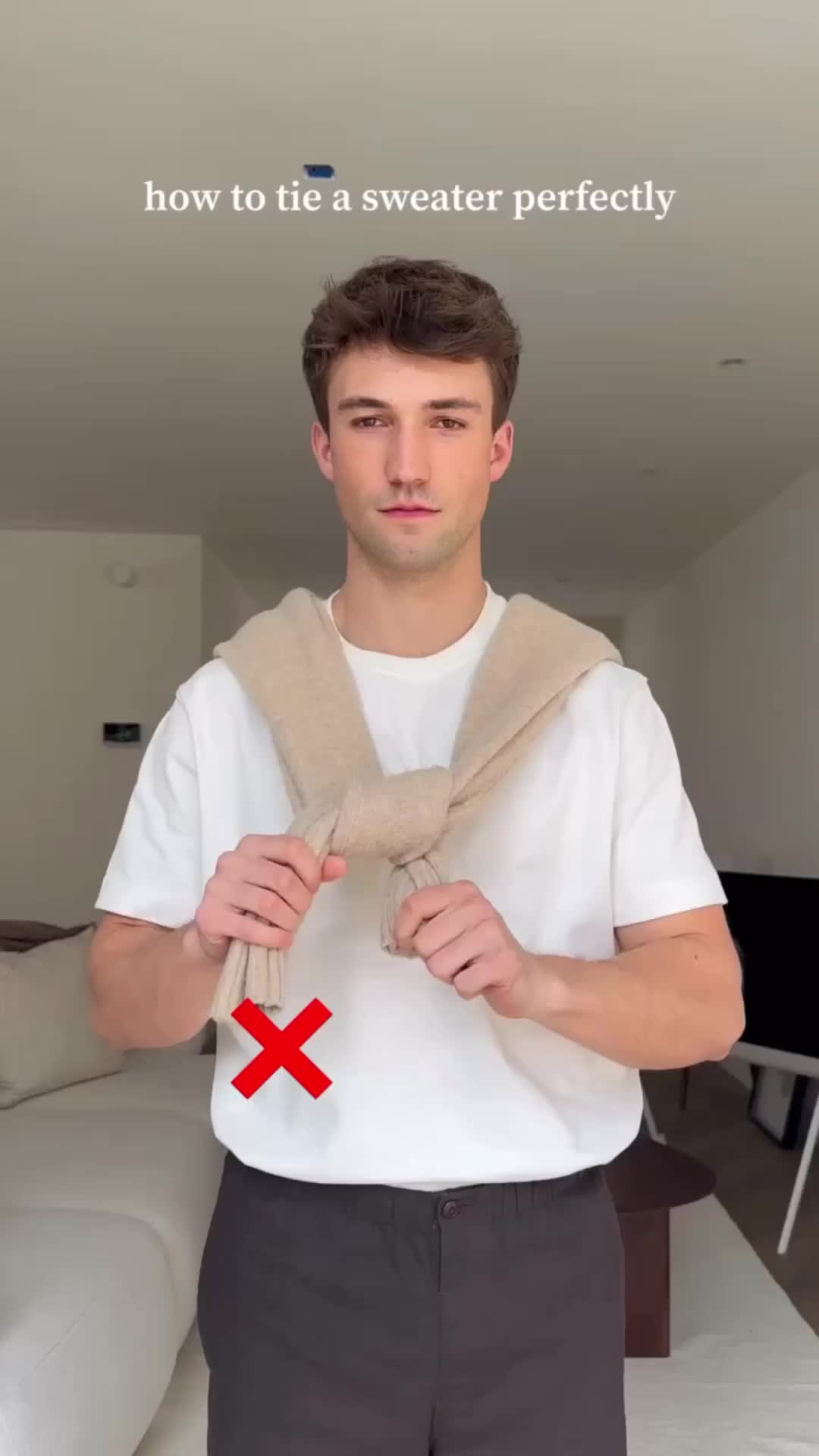 This contains an image of: how to tie a sweater tutorial !!