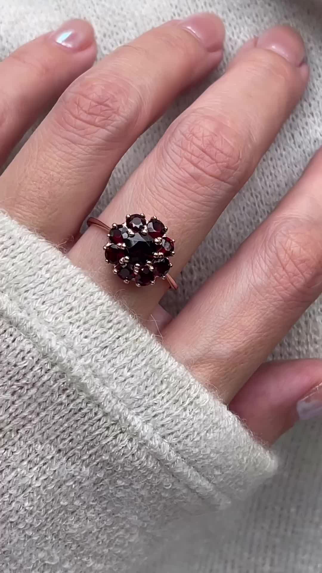 This Garnet Flower ring sets with 9 Garnet stones. The Flower ring is part of our everyday vintage jewelry collection.