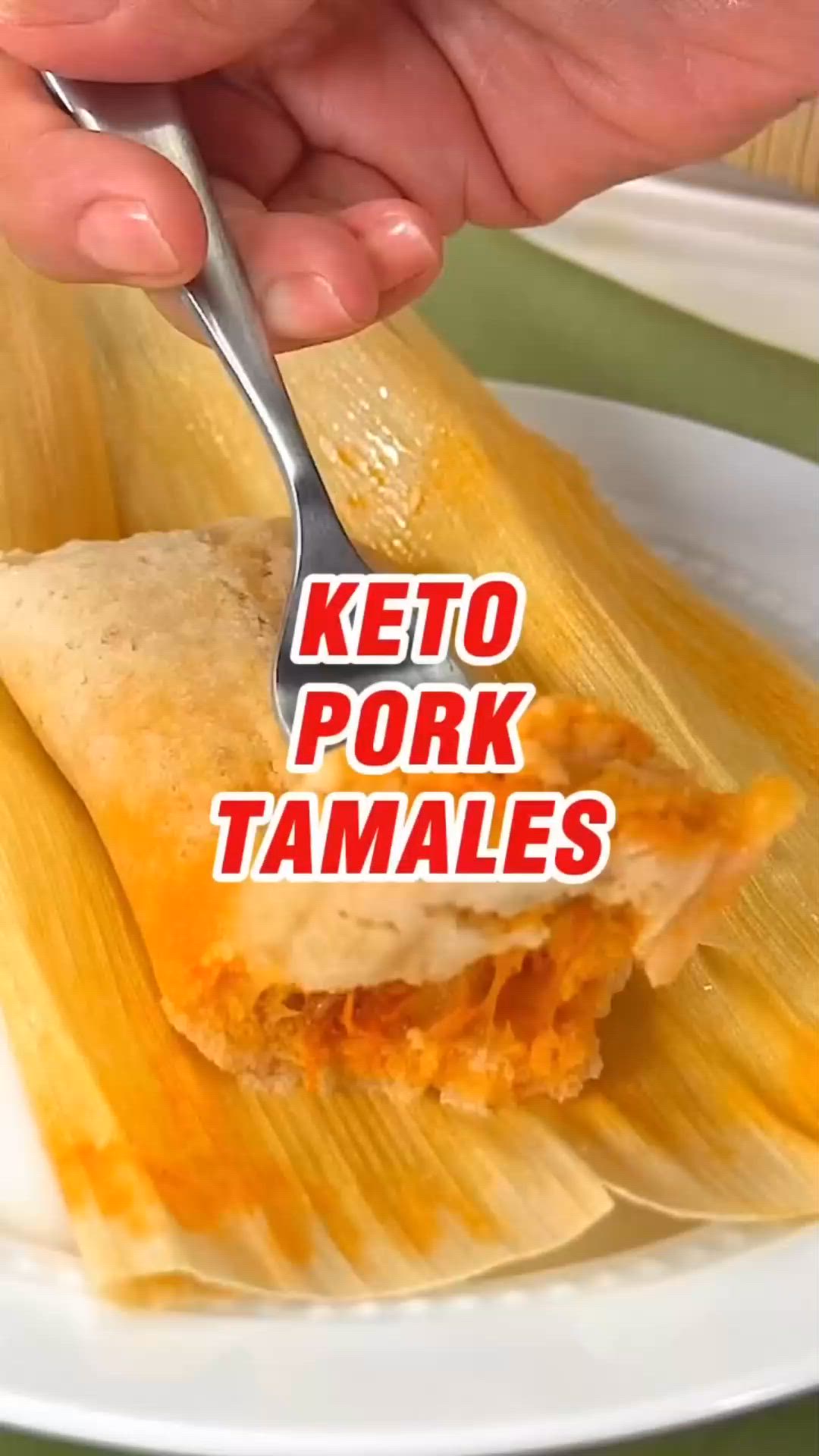 This may contain: a person holding a fork over some tamales on a plate with the words keto pork tamales