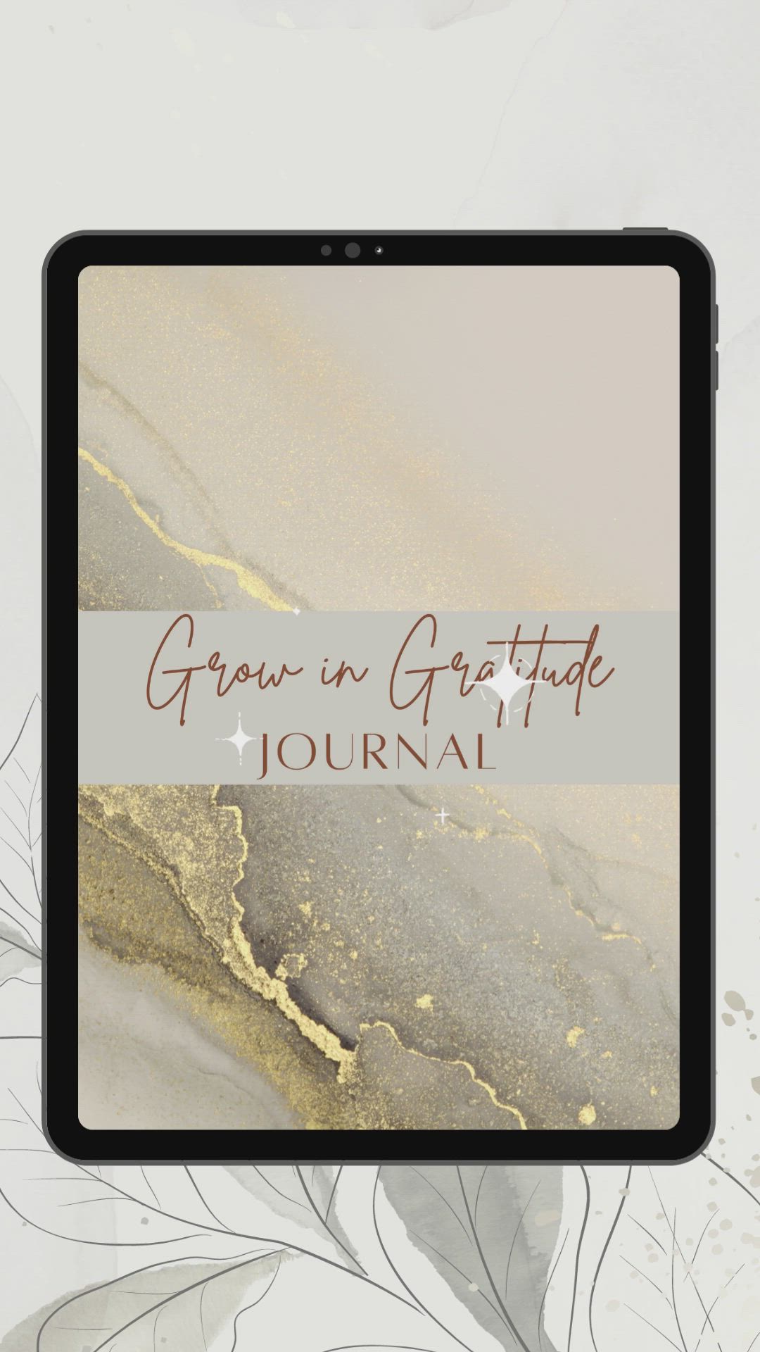 This may contain: a cell phone with the words grow in gratitude journal on it