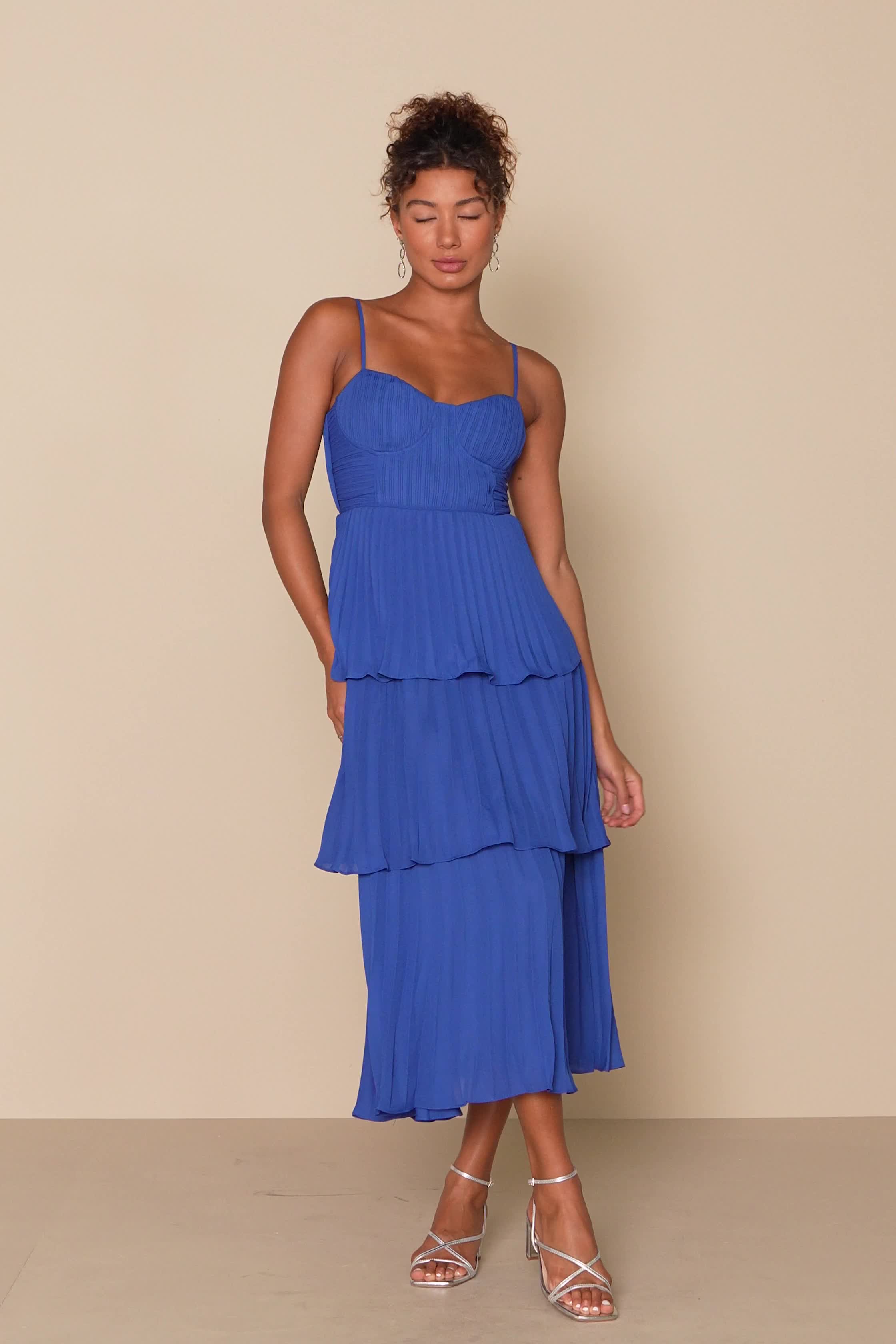 Get ready to be swept away to a world of romance by the Lulus Cascading Crush Cobalt Blue Tiered Bustier Midi Dress! Lightweight pleated woven fabric shapes adjustable spaghetti straps that support a bustier-style bodice with seamed cups. A fitted waist tops a tiered skirt that ends at a midi hem. Hidden back zipper/clasp. Fit: This garment fits true to size. Length: Mid-calf length. Size medium measures 44.5" from adjustable straps to hem. Bust: Great for any cup size. Waist: Fitted - very fitt