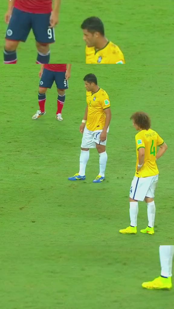 This may contain: two soccer players in yellow and white uniforms are on the field with one player looking at the ball