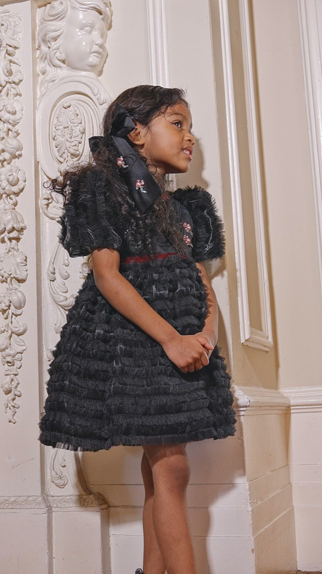 This contains: Make your little girl feel like a princess in the captivating Kylie Dress