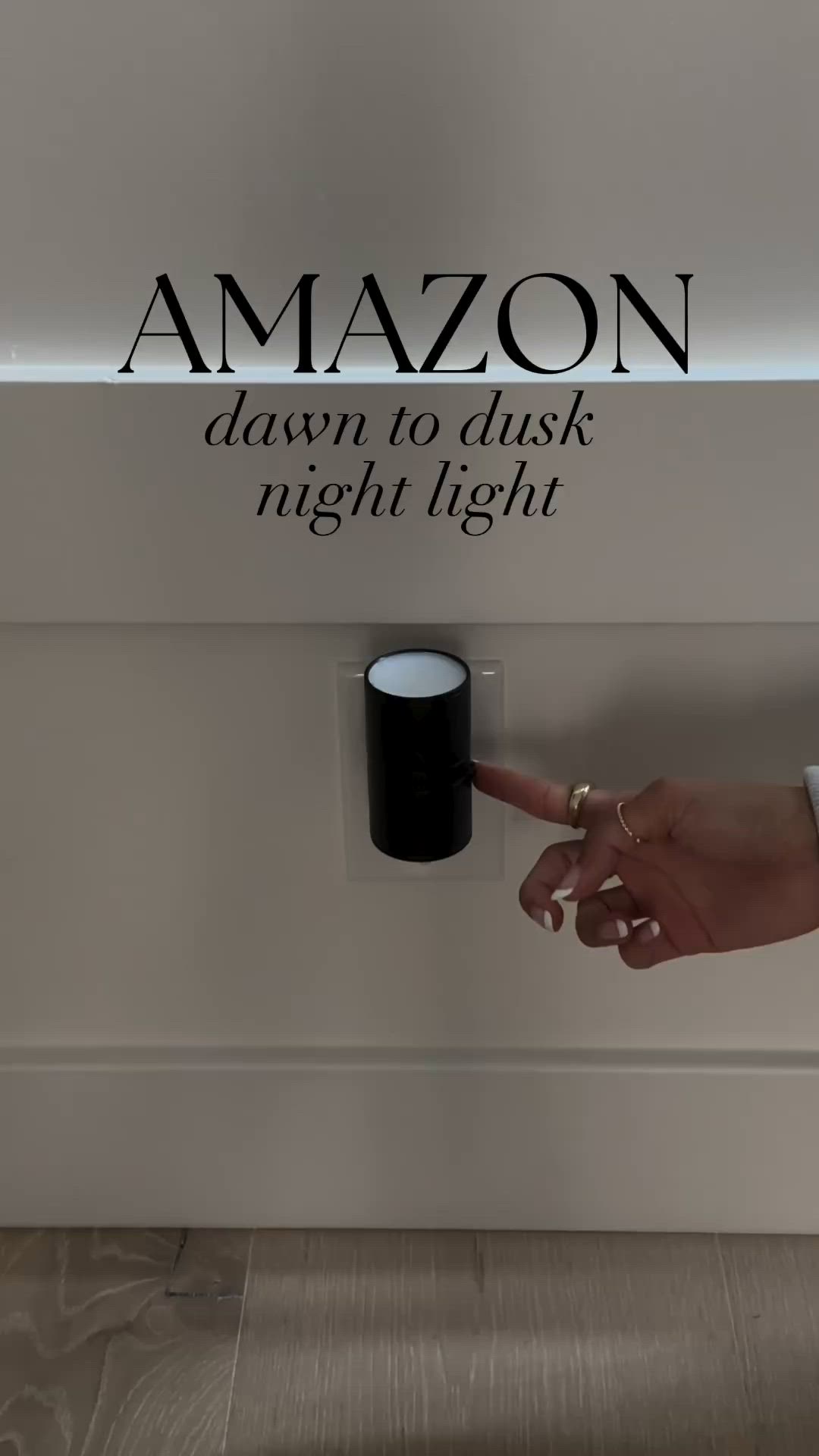 This may contain: a person is pressing the button on an amazon store's illuminated sign that says, dawn to dusk night light