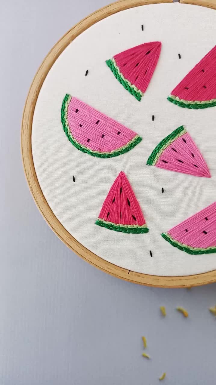 This may contain: a cross stitch project with watermelon slices on it and sprinkles