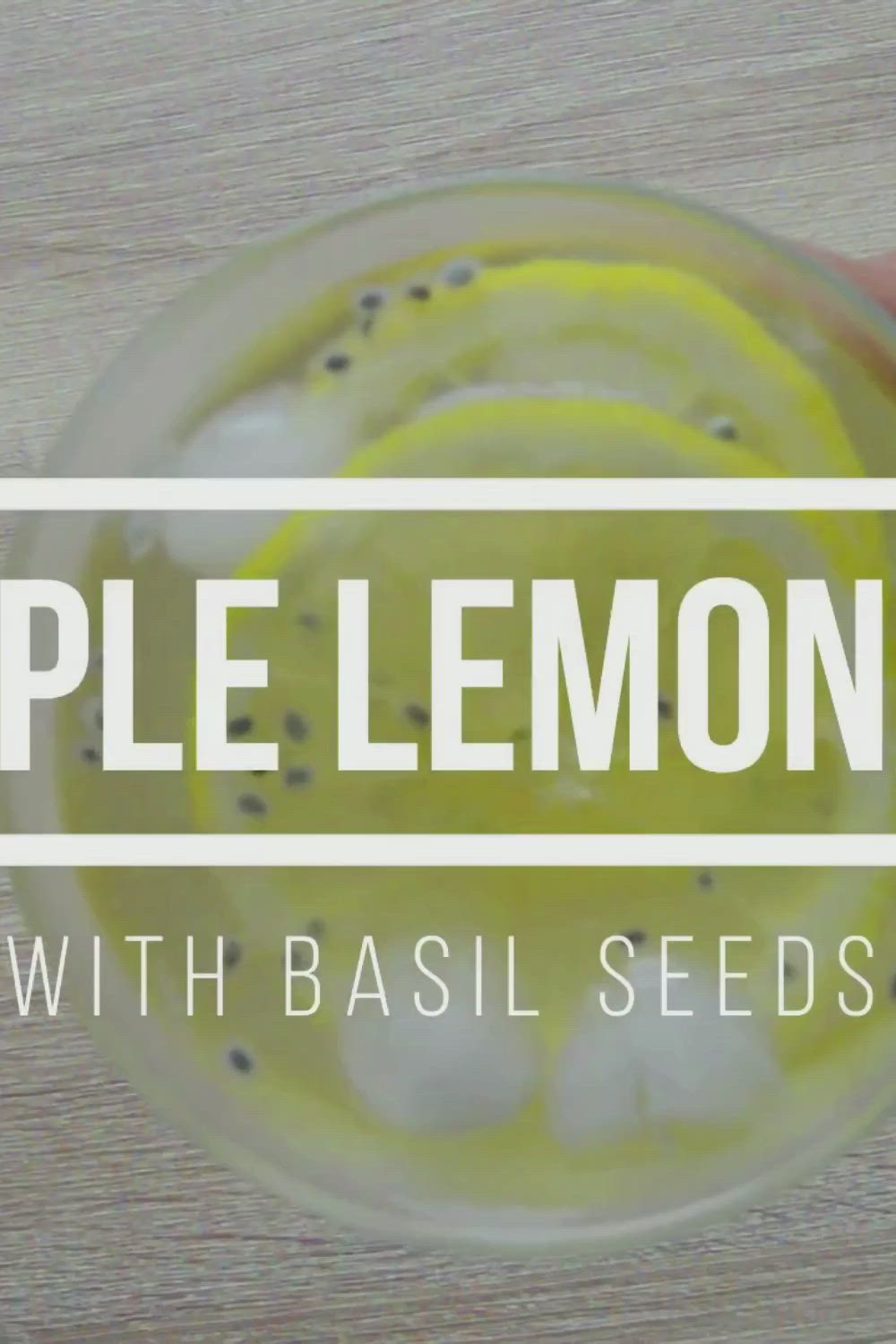 This may contain: lemonade with basil seeds in a glass next to sliced lemons