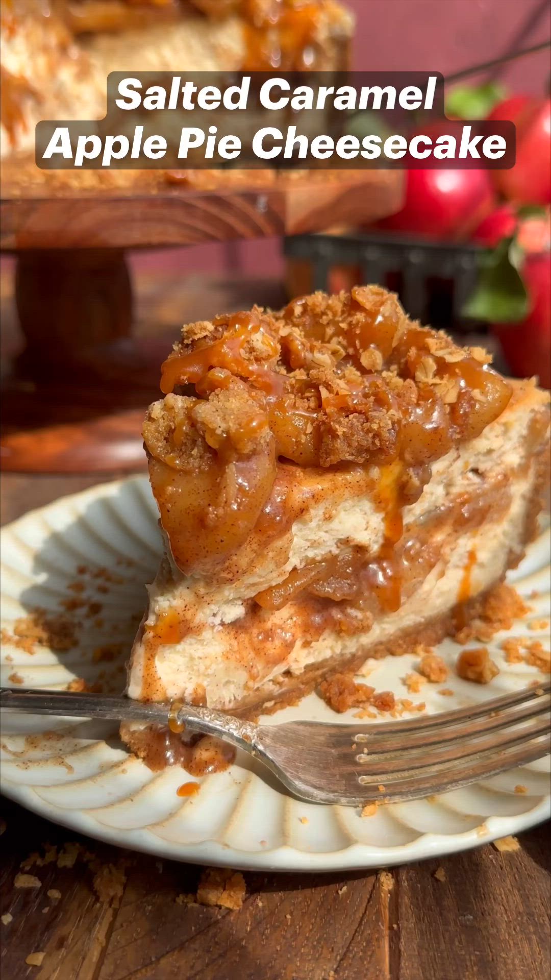 This may contain: a slice of apple pie cheesecake on a plate with the words salted caramel apple pie cheesecake