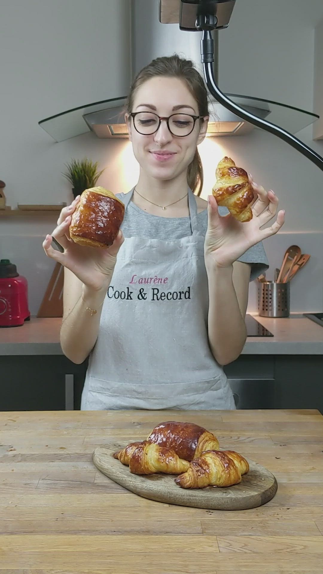 This may contain: croissants on a wooden plate with the title in french