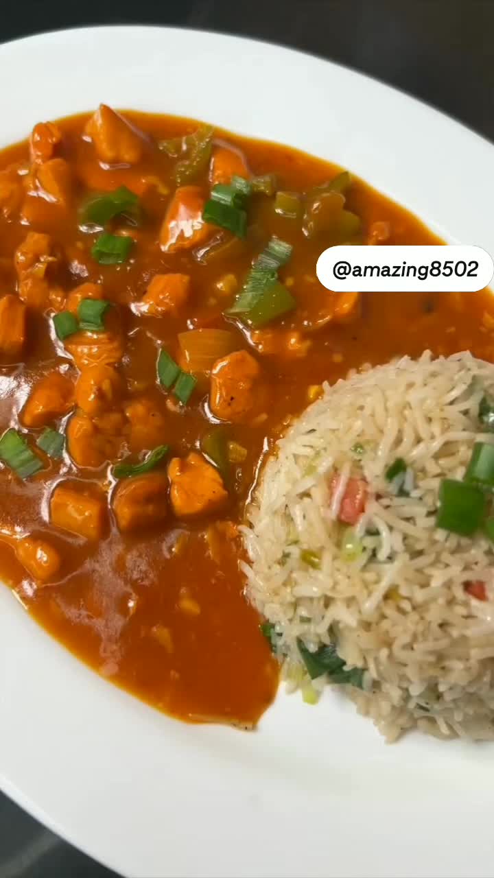 This may contain: a white plate topped with rice and veggies next to a bowl of soup