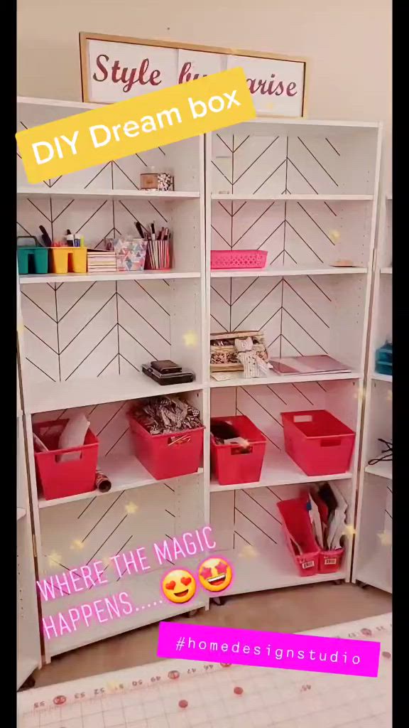 This may contain: there is a white shelf with pink bins and other items on it, along with the words diy dream box where the magic happens