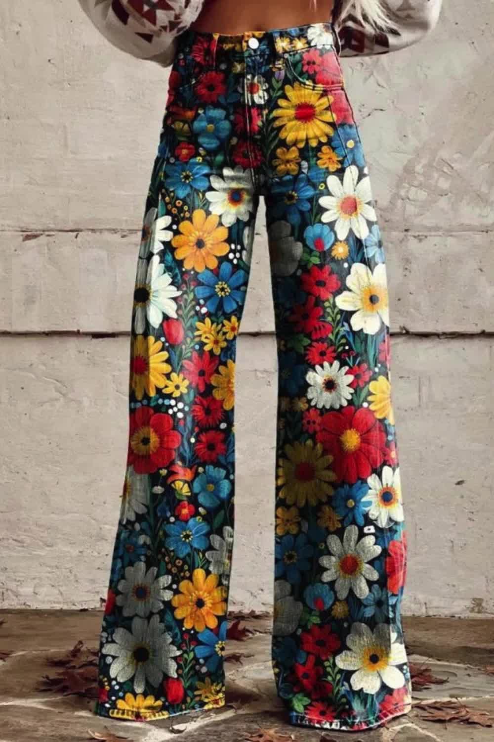 Make a bold statement with these Women's Colorful Flower Print Wide Leg Jeans. The vibrant floral design adds a playful and energetic touch to your outfit, perfect for expressing your individuality. Embrace the joy of color and style with these casual pants that are sure to turn heads wherever you go.