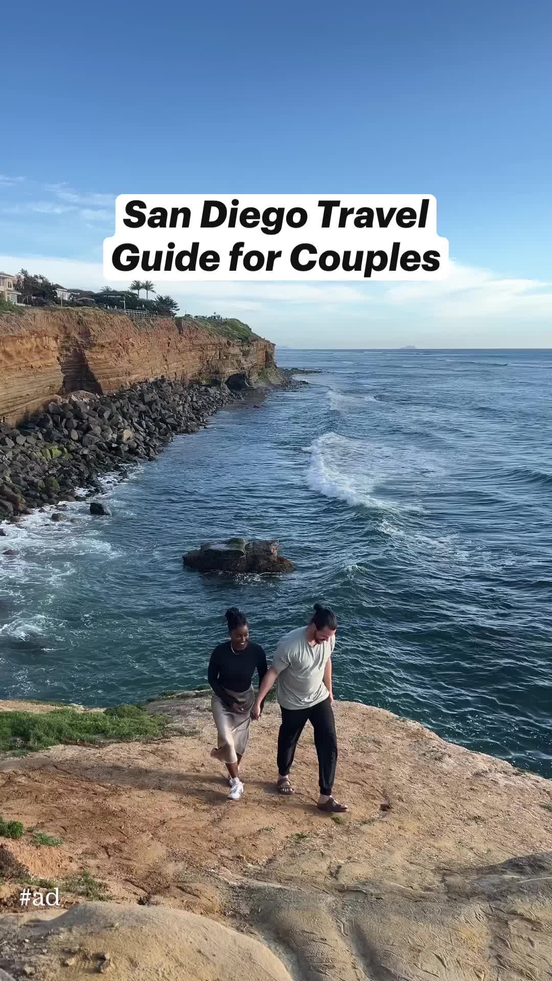 This may contain: two people walking along the edge of a cliff by the ocean with text overlay that reads san diego travel guide for couples