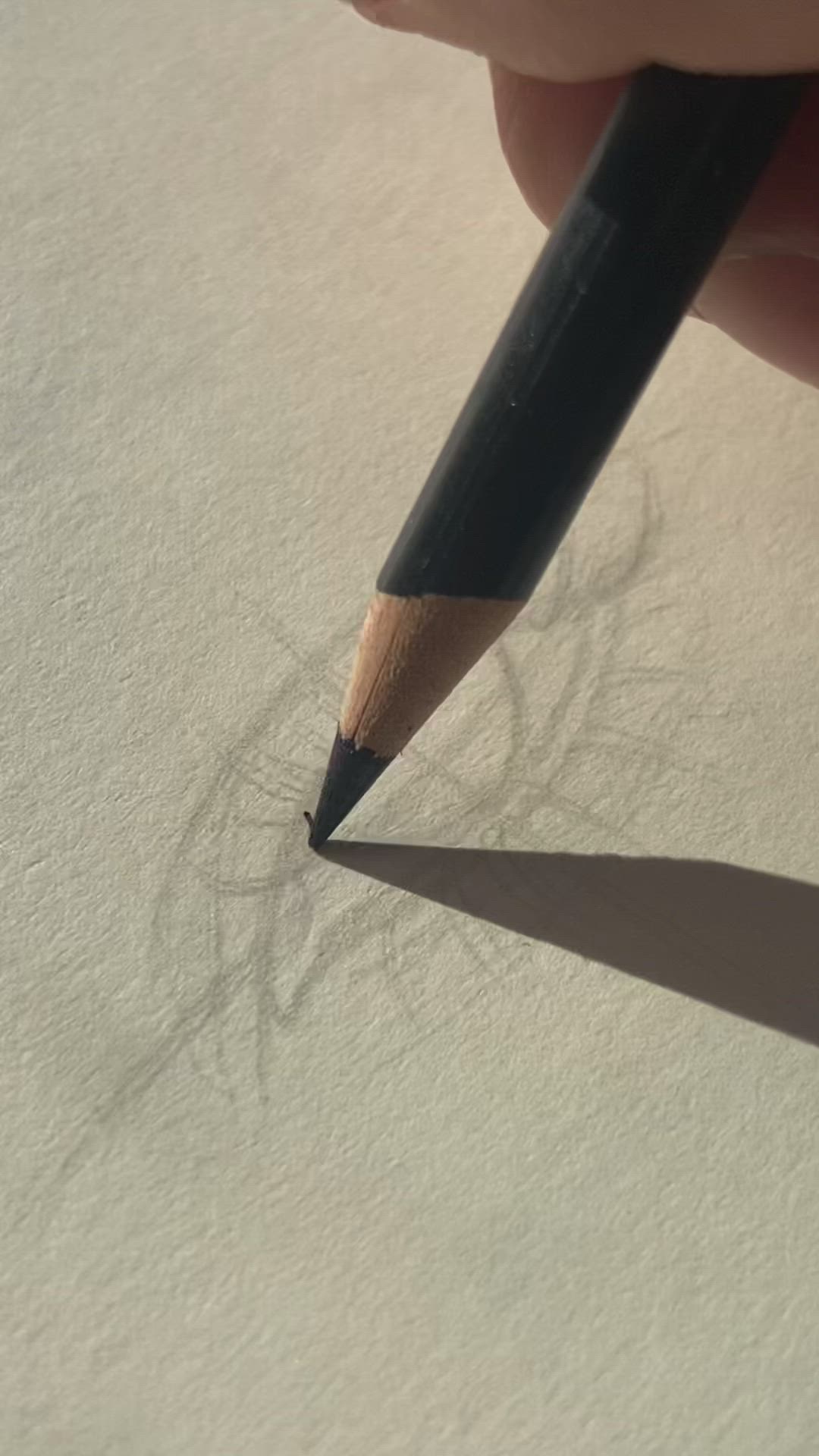 This may contain: someone is drawing an eye with a pencil