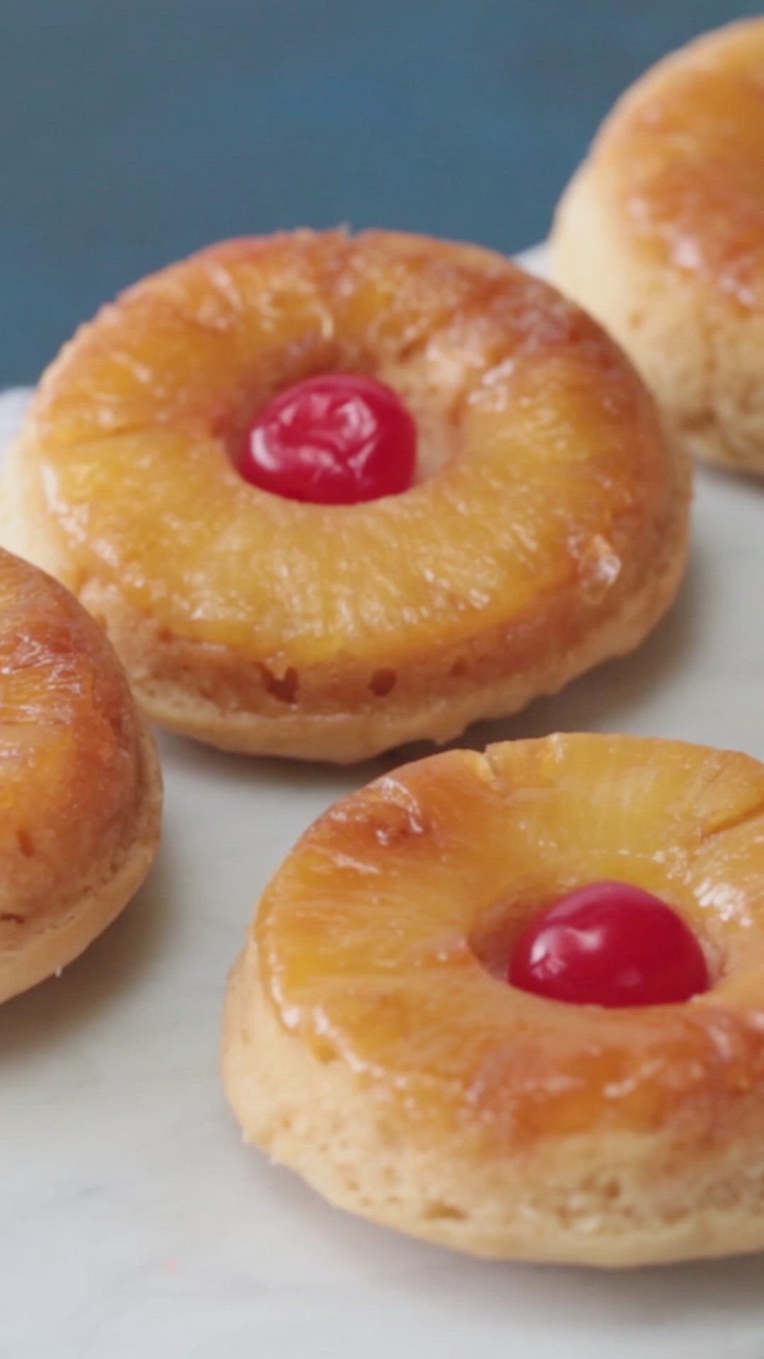 This may contain: pineapple upside down donuts on a plate with the words pineapple upside down