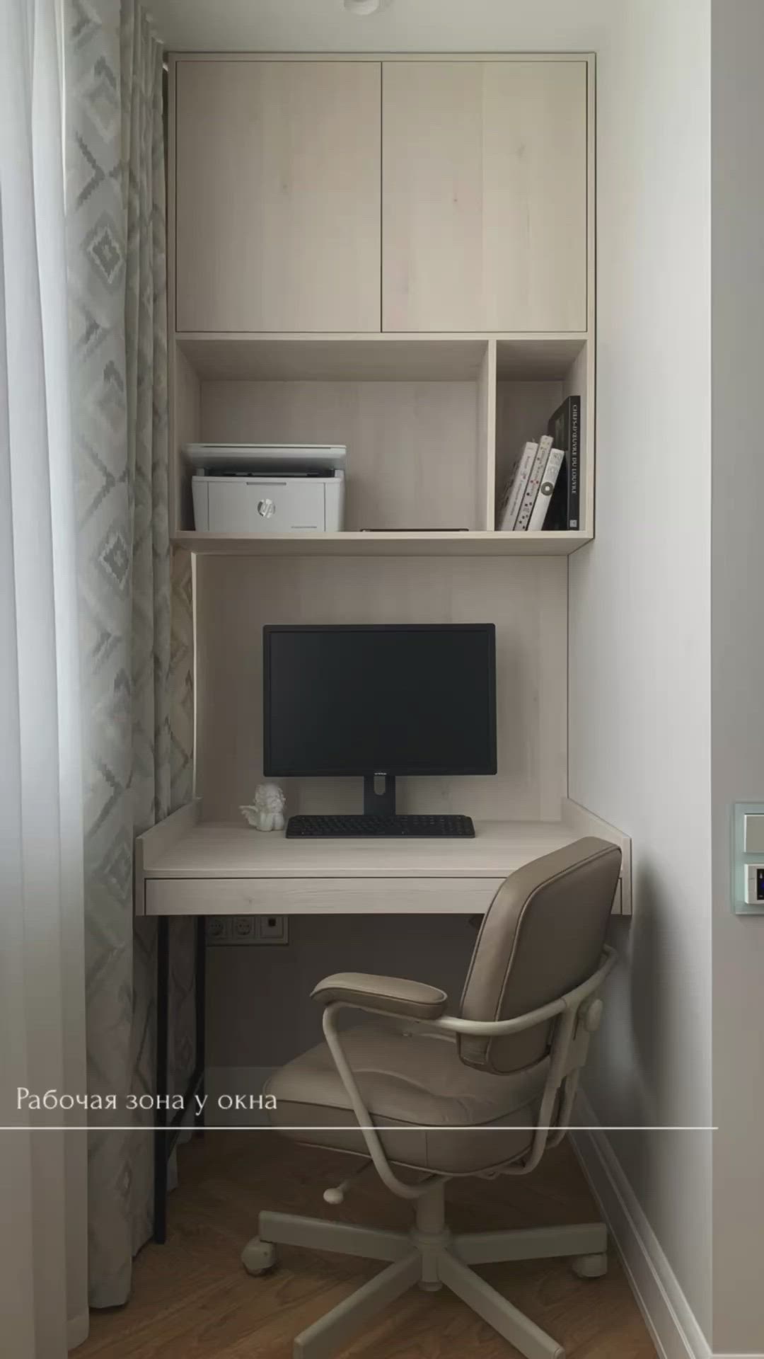 This may contain: a white desk with a computer on top of it