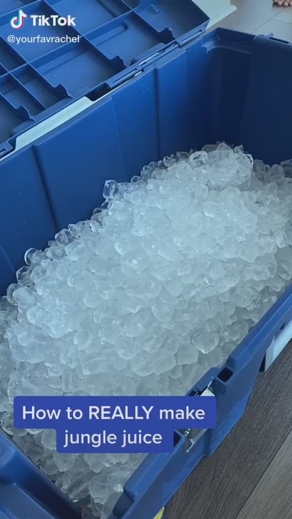 This may contain: a blue container filled with ice on top of a wooden floor