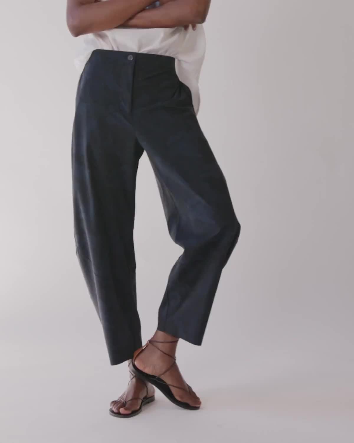 Our famous style in classic black. These pants are a standout yet comfortable pair. Style with your favorite blouse or top for an easy, everyday style. *We recommend taking one size down in this style if a closer fit is preferred. Hits above the ankle Slight stretch Relaxed fit Tapered leg Side pockets