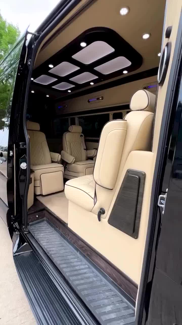 This may contain: the interior of a luxury vehicle with its doors open