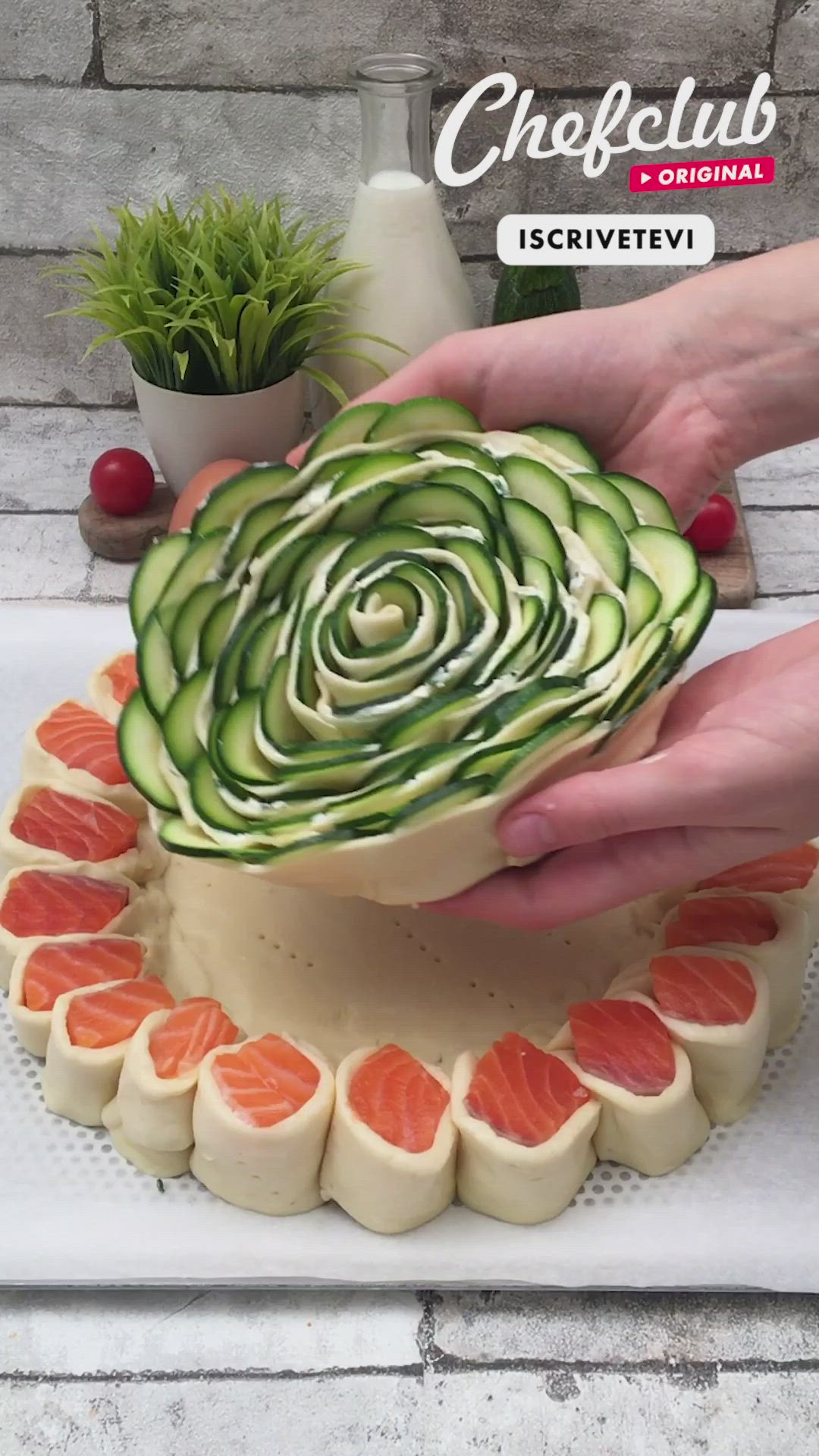 This may contain: someone is decorating a cucumber cake with sushi on the bottom and in the middle