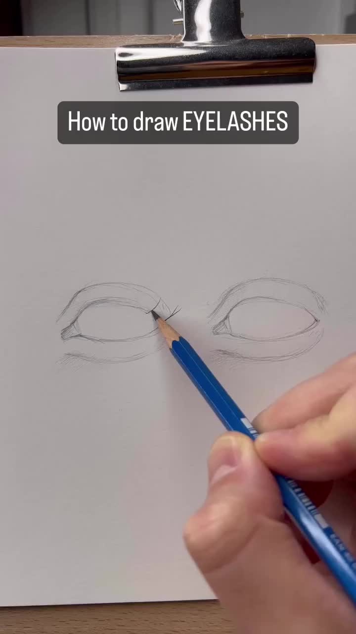 This may contain: someone is drawing an eye with pencils on a piece of paper that says how to draw eyelashes