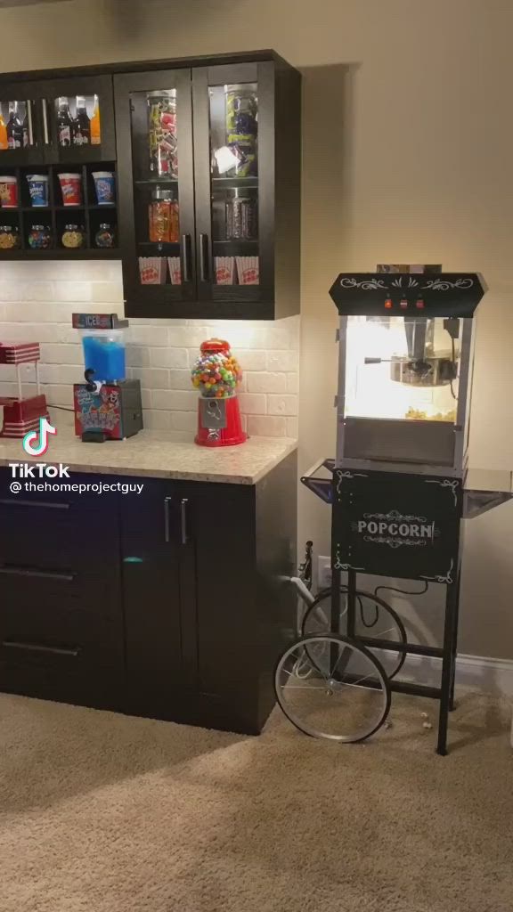 This may contain: a small kitchen with a vending machine in the corner