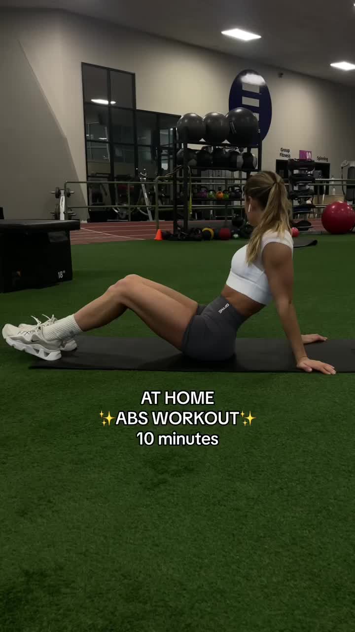 This may contain: a woman is doing an exercise on a mat with the words at home abs workout 10 minutes