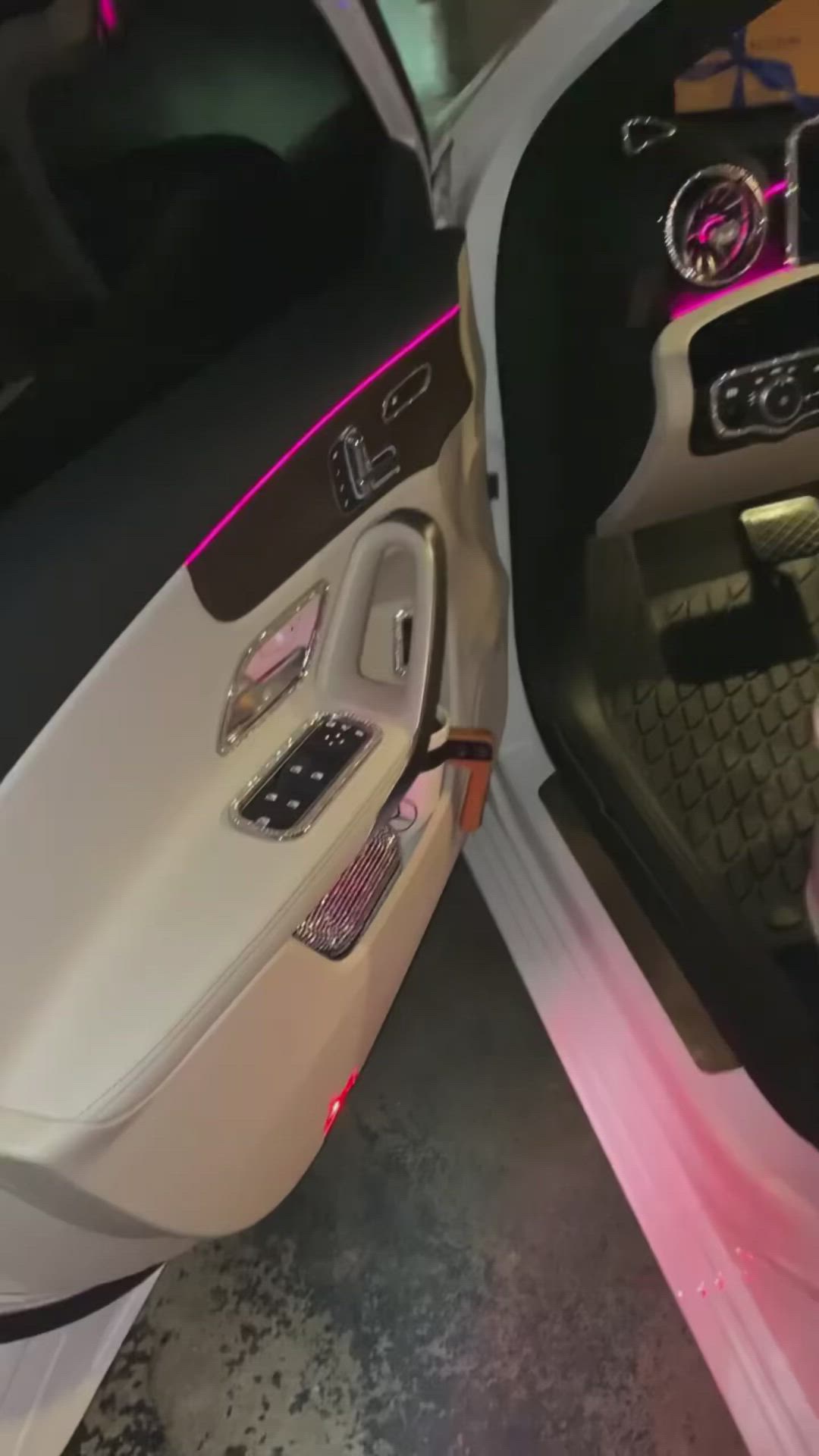 This may contain: the inside of a car with its door open and lights on, showing it's interior