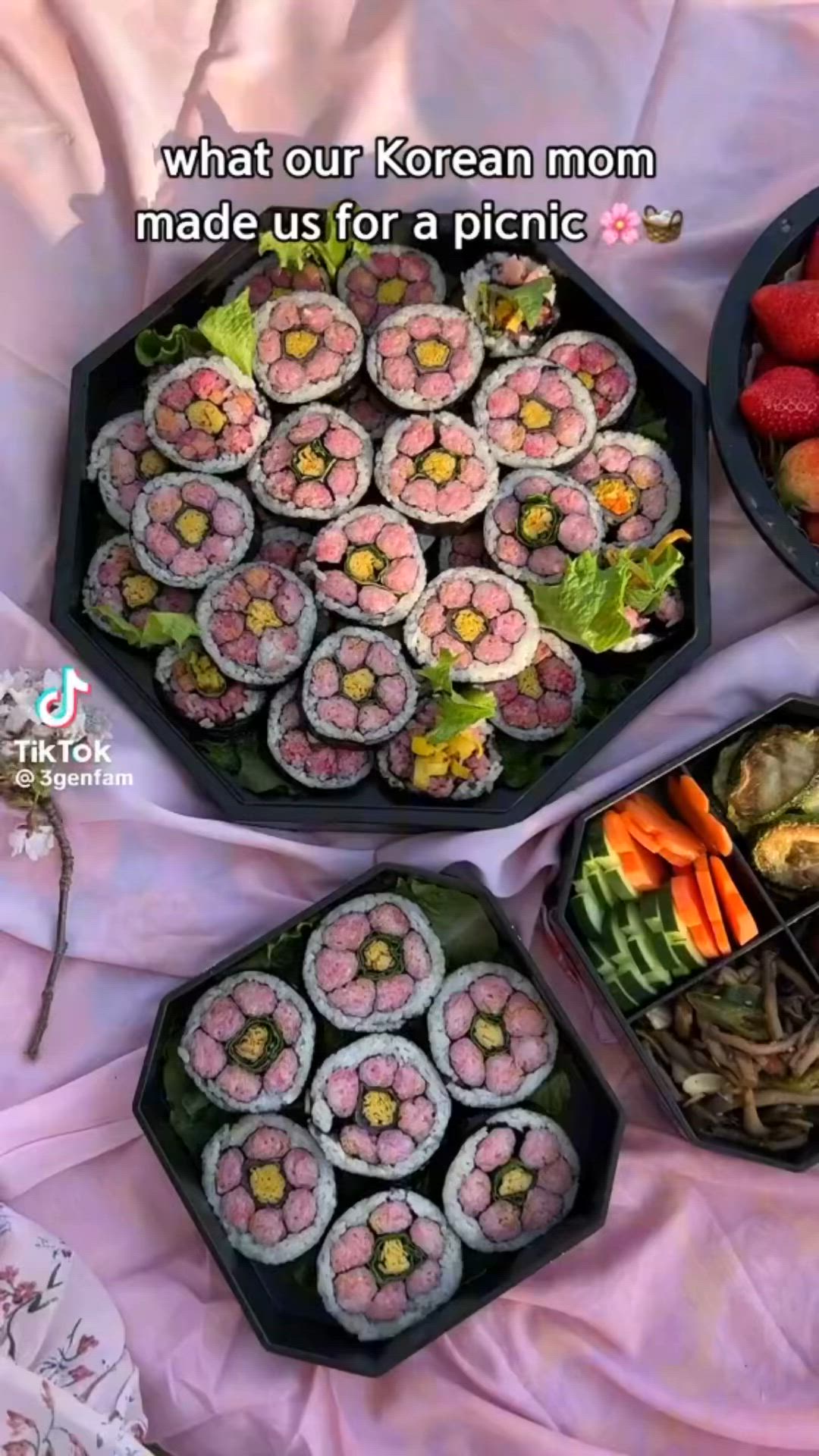 This may contain: four trays filled with different types of sushi and other foods on a table