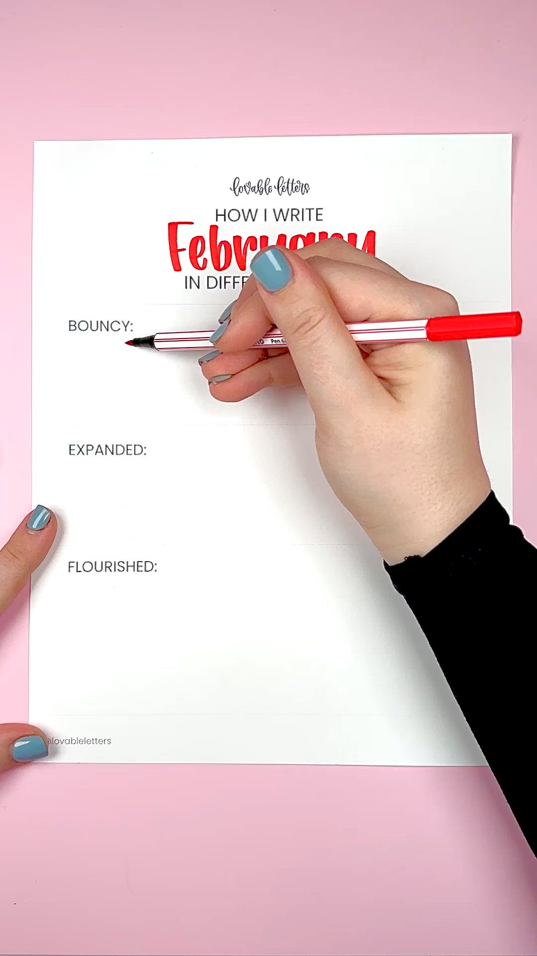 This may contain: a person holding a pen and writing on a piece of paper with the words february in different styles