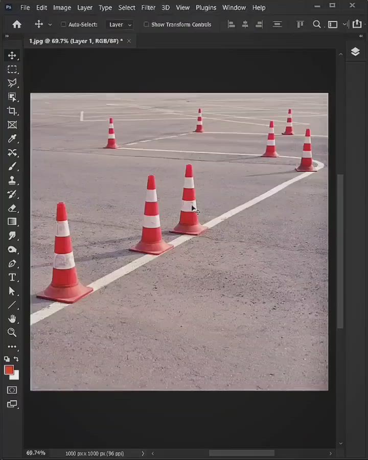 This may contain: an image of orange and white cones in the middle of a parking lot with no cars